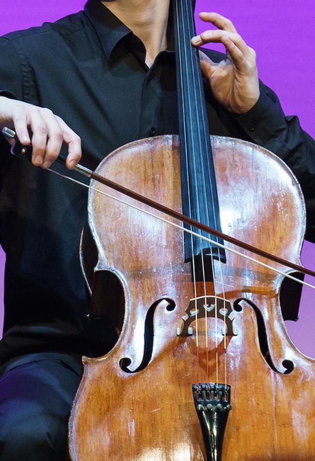 Close-up photo of a celloist