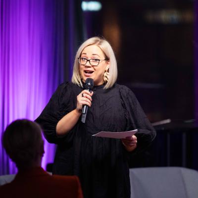 Executive Director Ninni Sulva-Vakkilainen gives a welcome speech. Photo: Jani Telatie