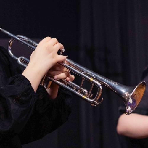 Student holding a trumpet